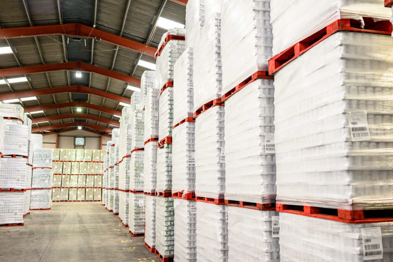 The inside of one of Knowles' warehouses, showing pallets of products stacked high